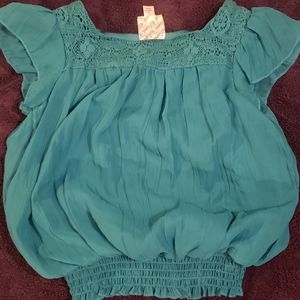 D Signed size S ruffle Sleeve Turquoise Top